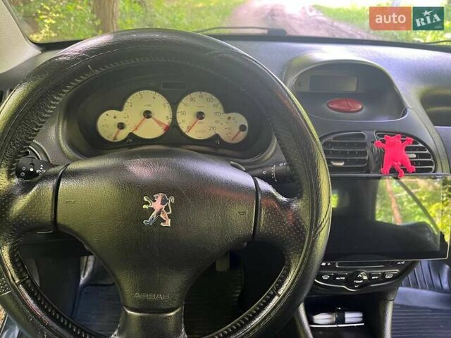 Синий Пежо 206, объемом двигателя 1.6 л и пробегом 251 тыс. км за 4100 $, фото 7 на Automoto.ua
