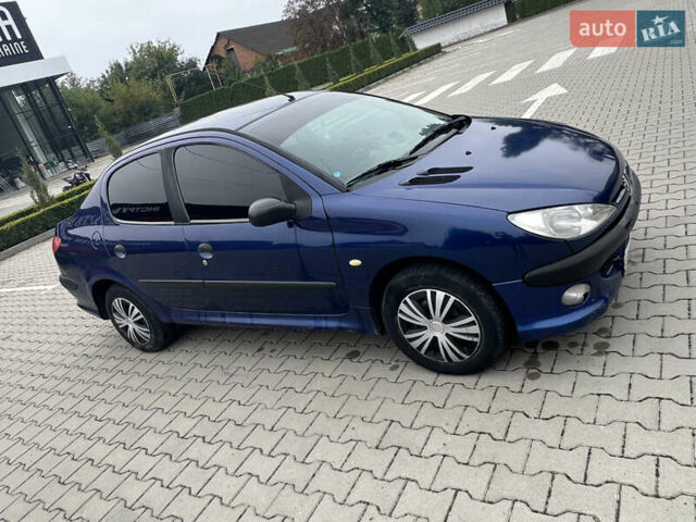 Синий Пежо 206, объемом двигателя 1.36 л и пробегом 253 тыс. км за 2100 $, фото 6 на Automoto.ua
