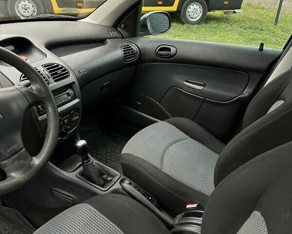 Синий Пежо 206, объемом двигателя 1.36 л и пробегом 217 тыс. км за 3150 $, фото 18 на Automoto.ua