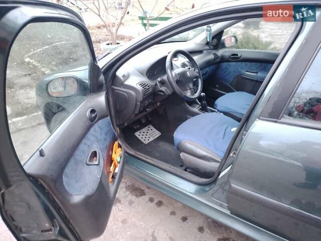 Зеленый Пежо 206, объемом двигателя 1.4 л и пробегом 290 тыс. км за 2700 $, фото 16 на Automoto.ua