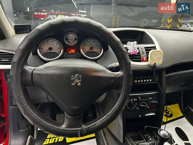 Красный Пежо 207, объемом двигателя 1.36 л и пробегом 169 тыс. км за 4500 $, фото 7 на Automoto.ua
