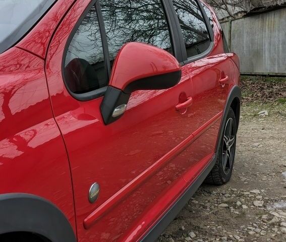 Красный Пежо 207, объемом двигателя 1.6 л и пробегом 230 тыс. км за 5300 $, фото 2 на Automoto.ua