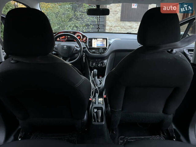 Черный Пежо 208, объемом двигателя 1.4 л и пробегом 200 тыс. км за 6200 $, фото 10 на Automoto.ua