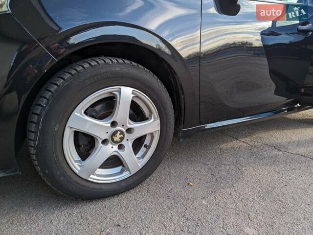 Чорний Пежо 208, об'ємом двигуна 1.4 л та пробігом 189 тис. км за 7000 $, фото 13 на Automoto.ua
