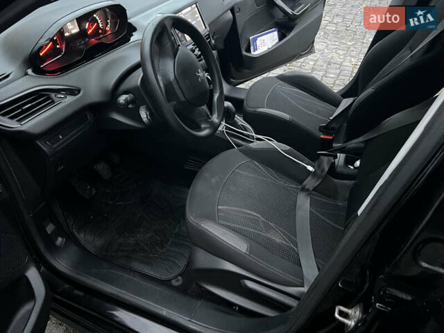 Черный Пежо 208, объемом двигателя 1.4 л и пробегом 200 тыс. км за 6200 $, фото 12 на Automoto.ua