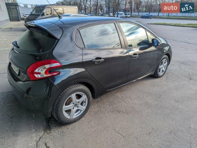 Чорний Пежо 208, об'ємом двигуна 1.4 л та пробігом 189 тис. км за 7000 $, фото 4 на Automoto.ua
