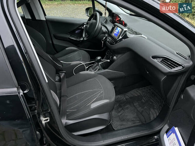 Черный Пежо 208, объемом двигателя 1.4 л и пробегом 200 тыс. км за 6200 $, фото 7 на Automoto.ua