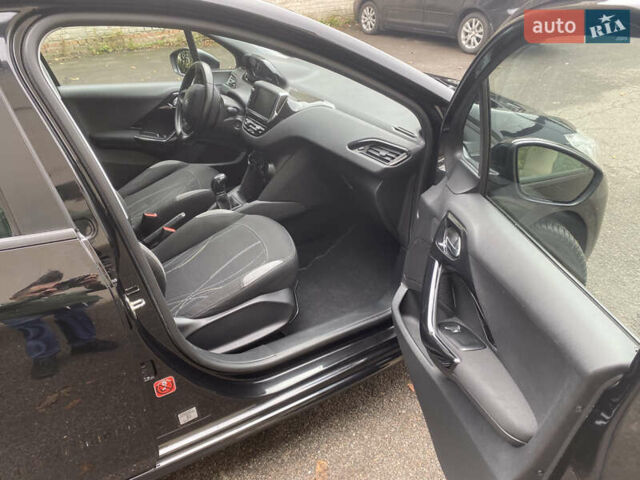 Черный Пежо 208, объемом двигателя 1.56 л и пробегом 214 тыс. км за 8250 $, фото 13 на Automoto.ua