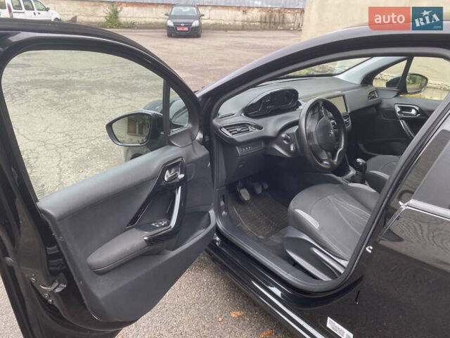 Черный Пежо 208, объемом двигателя 1.56 л и пробегом 214 тыс. км за 8250 $, фото 8 на Automoto.ua