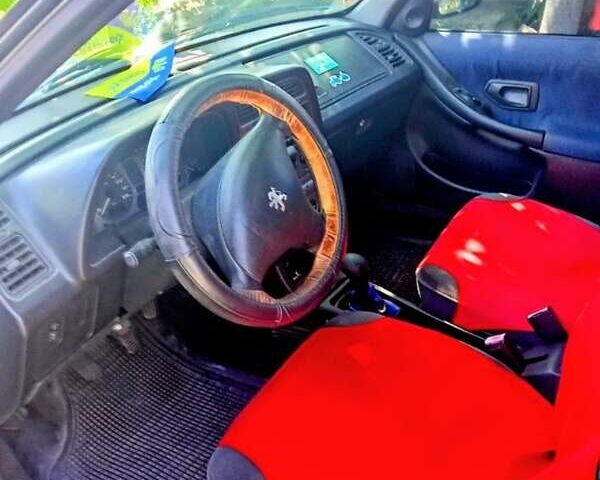 Белый Пежо 306, объемом двигателя 1.36 л и пробегом 250 тыс. км за 2500 $, фото 3 на Automoto.ua