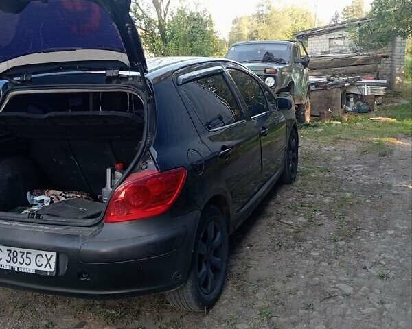 Черный Пежо 307, объемом двигателя 2 л и пробегом 310 тыс. км за 2900 $, фото 10 на Automoto.ua