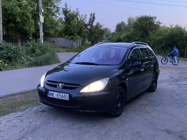 Черный Пежо 307, объемом двигателя 2 л и пробегом 334 тыс. км за 1950 $, фото 4 на Automoto.ua