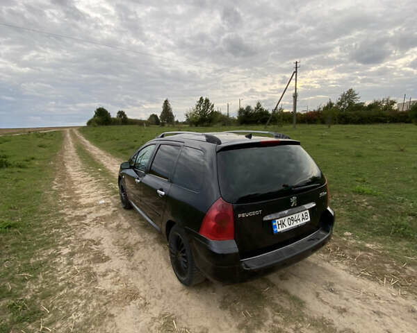 Черный Пежо 307, объемом двигателя 2 л и пробегом 258 тыс. км за 3300 $, фото 1 на Automoto.ua
