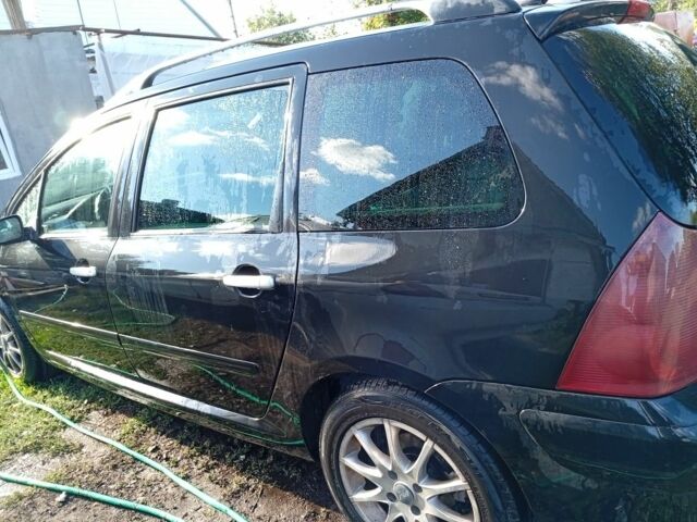 Черный Пежо 307, объемом двигателя 2 л и пробегом 235 тыс. км за 4200 $, фото 5 на Automoto.ua