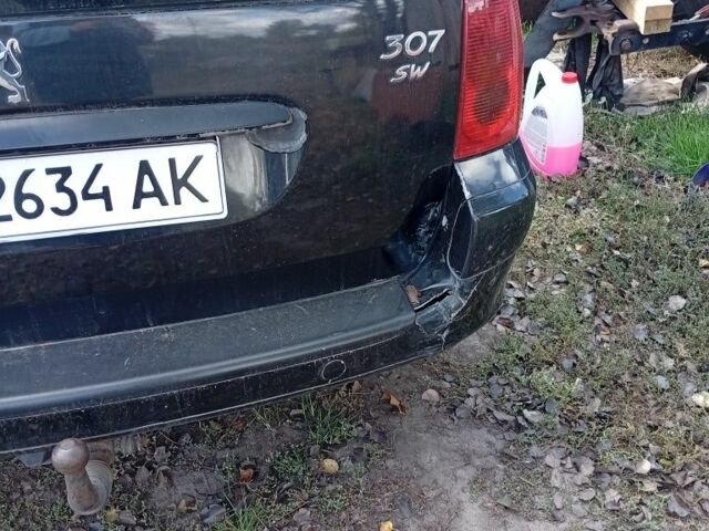 Черный Пежо 307, объемом двигателя 2 л и пробегом 235 тыс. км за 4200 $, фото 12 на Automoto.ua