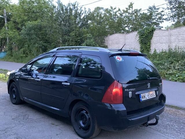 Черный Пежо 307, объемом двигателя 2 л и пробегом 334 тыс. км за 1950 $, фото 3 на Automoto.ua