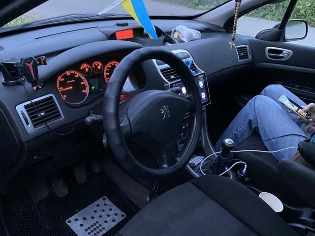 Черный Пежо 307, объемом двигателя 2 л и пробегом 334 тыс. км за 1950 $, фото 6 на Automoto.ua