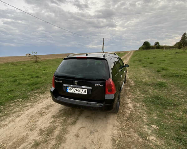 Черный Пежо 307, объемом двигателя 2 л и пробегом 258 тыс. км за 3300 $, фото 3 на Automoto.ua