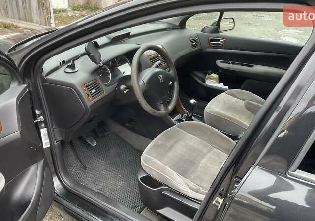 Чорний Пежо 307, об'ємом двигуна 1.4 л та пробігом 385 тис. км за 3350 $, фото 5 на Automoto.ua