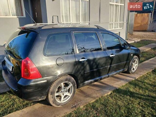 Черный Пежо 307, объемом двигателя 1.59 л и пробегом 306 тыс. км за 3850 $, фото 7 на Automoto.ua