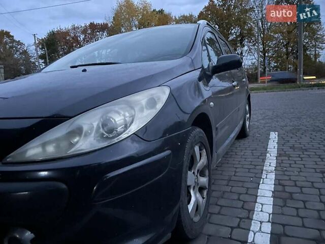 Черный Пежо 307, объемом двигателя 2 л и пробегом 256 тыс. км за 4900 $, фото 1 на Automoto.ua