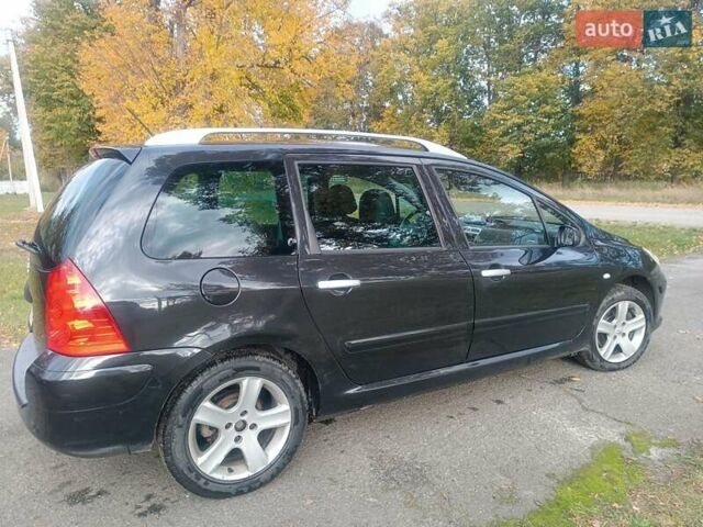 Черный Пежо 307, объемом двигателя 2 л и пробегом 300 тыс. км за 5500 $, фото 11 на Automoto.ua
