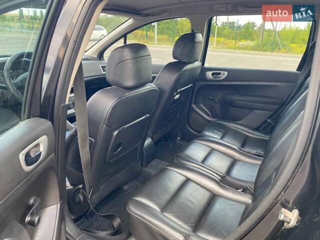 Черный Пежо 307, объемом двигателя 1.59 л и пробегом 303 тыс. км за 3900 $, фото 6 на Automoto.ua