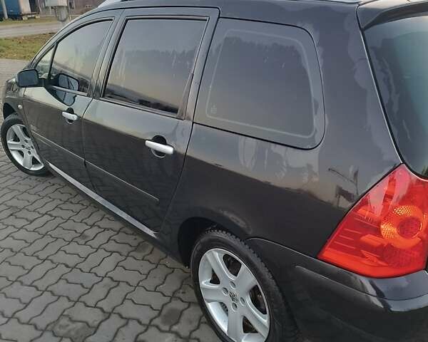 Черный Пежо 307, объемом двигателя 1.56 л и пробегом 328 тыс. км за 4700 $, фото 7 на Automoto.ua