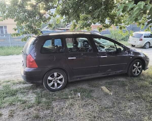 Фиолетовый Пежо 307, объемом двигателя 2 л и пробегом 200 тыс. км за 4500 $, фото 6 на Automoto.ua