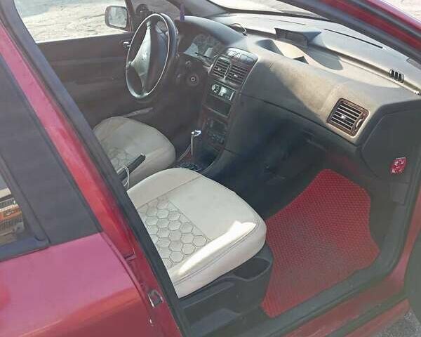 Червоний Пежо 307, об'ємом двигуна 2 л та пробігом 230 тис. км за 3200 $, фото 8 на Automoto.ua
