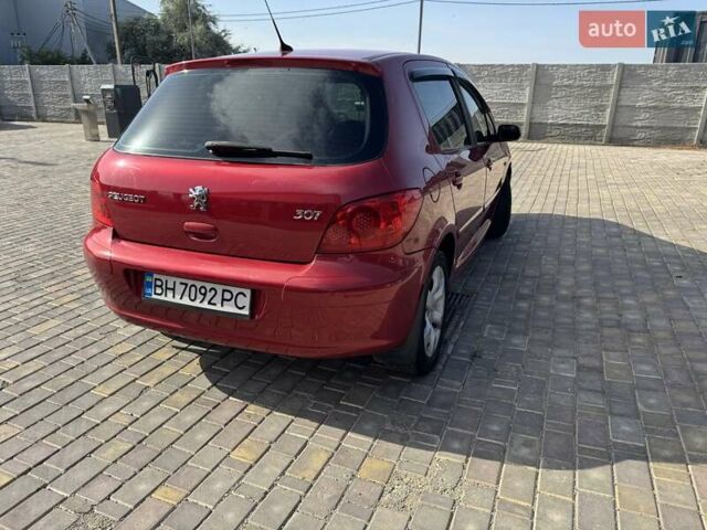 Красный Пежо 307, объемом двигателя 2 л и пробегом 215 тыс. км за 5499 $, фото 1 на Automoto.ua