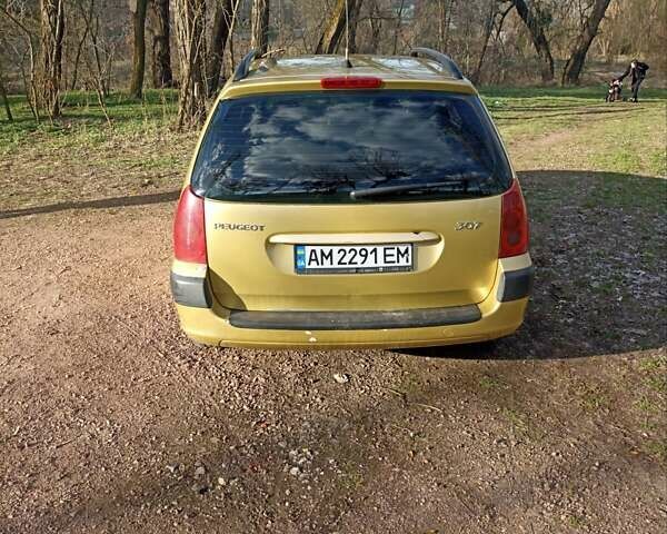 Желтый Пежо 307, объемом двигателя 1.36 л и пробегом 301 тыс. км за 3950 $, фото 4 на Automoto.ua
