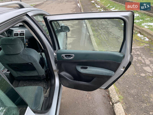 Сірий Пежо 307, об'ємом двигуна 1.59 л та пробігом 300 тис. км за 2000 $, фото 27 на Automoto.ua