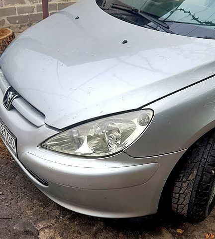 Серый Пежо 307, объемом двигателя 1.6 л и пробегом 205 тыс. км за 2100 $, фото 4 на Automoto.ua