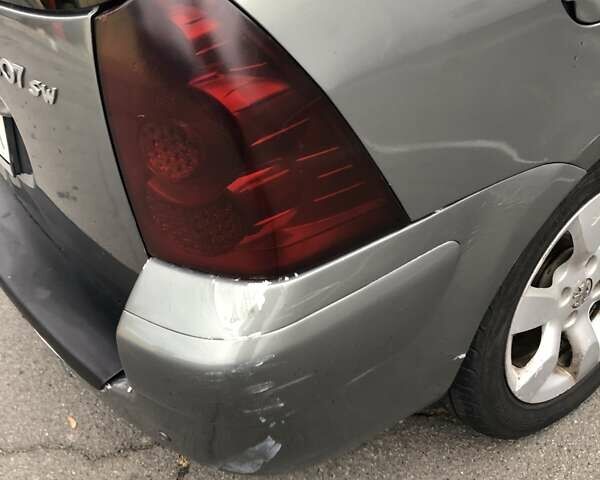 Серый Пежо 307, объемом двигателя 2 л и пробегом 216 тыс. км за 3200 $, фото 1 на Automoto.ua