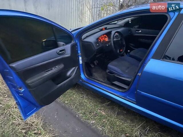 Синий Пежо 307, объемом двигателя 1.4 л и пробегом 286 тыс. км за 1950 $, фото 9 на Automoto.ua