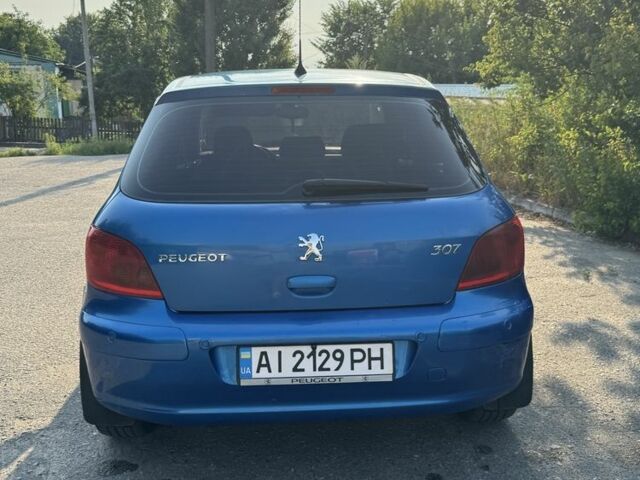 Синий Пежо 307, объемом двигателя 2 л и пробегом 235 тыс. км за 3900 $, фото 4 на Automoto.ua