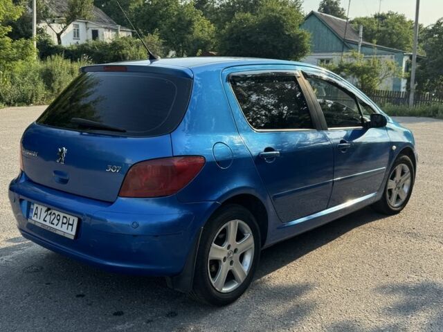 Синий Пежо 307, объемом двигателя 2 л и пробегом 235 тыс. км за 3900 $, фото 5 на Automoto.ua