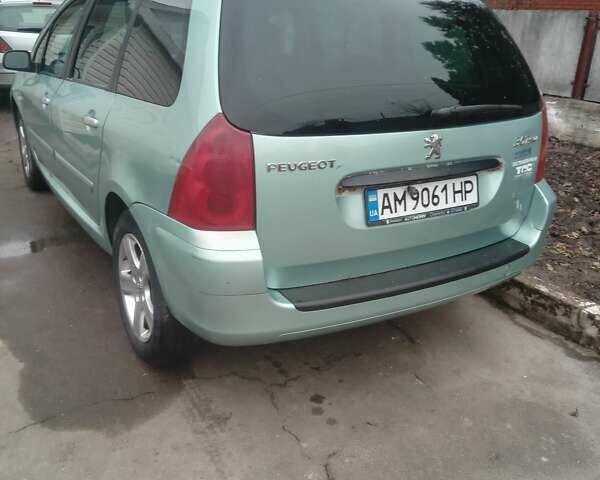Зелений Пежо 307, об'ємом двигуна 1.59 л та пробігом 300 тис. км за 3799 $, фото 4 на Automoto.ua