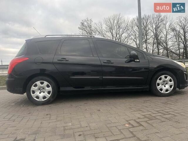 Черный Пежо 308, объемом двигателя 1.6 л и пробегом 292 тыс. км за 6200 $, фото 16 на Automoto.ua
