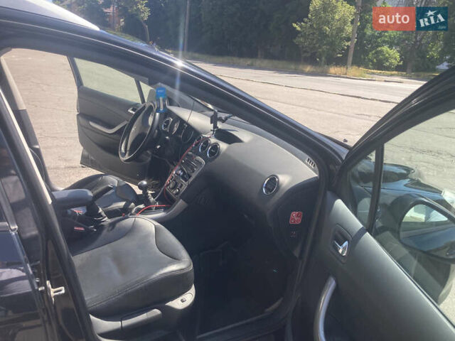Черный Пежо 308, объемом двигателя 2 л и пробегом 250 тыс. км за 7199 $, фото 25 на Automoto.ua
