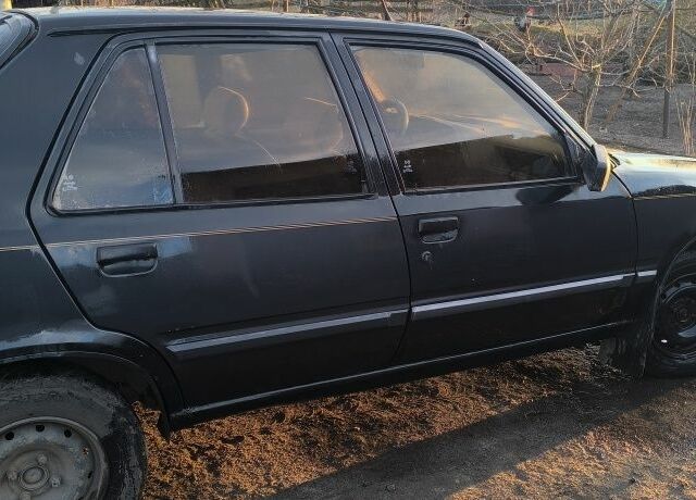 Черный Пежо 309, объемом двигателя 1.4 л и пробегом 89 тыс. км за 300 $, фото 3 на Automoto.ua