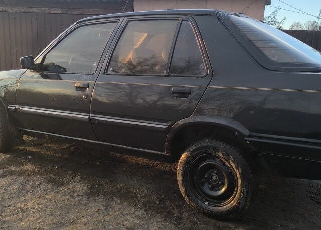 Черный Пежо 309, объемом двигателя 1.4 л и пробегом 89 тыс. км за 300 $, фото 1 на Automoto.ua