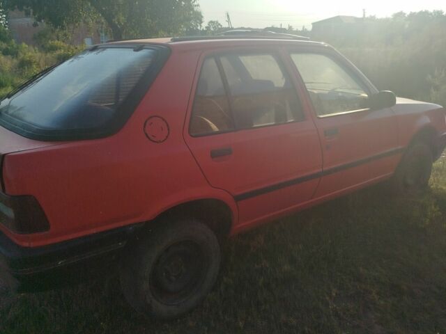 Червоний Пежо 309, об'ємом двигуна 2 л та пробігом 60 тис. км за 650 $, фото 7 на Automoto.ua
