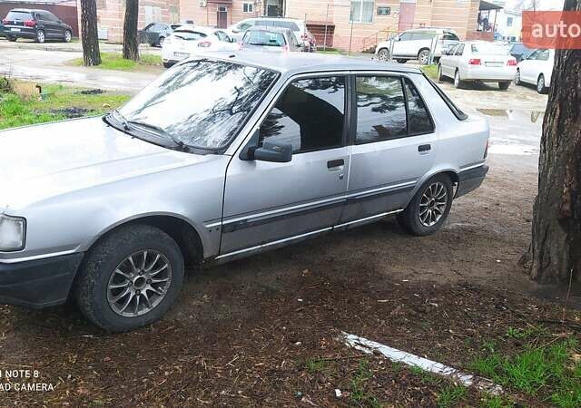 Серый Пежо 309, объемом двигателя 1.4 л и пробегом 222 тыс. км за 1300 $, фото 1 на Automoto.ua