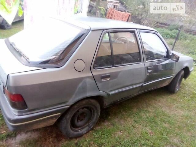 Сірий Пежо 309, об'ємом двигуна 1.36 л та пробігом 350 тис. км за 600 $, фото 1 на Automoto.ua