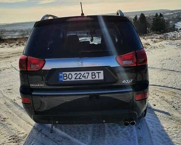 Черный Пежо 4007, объемом двигателя 2.2 л и пробегом 180 тыс. км за 11000 $, фото 2 на Automoto.ua