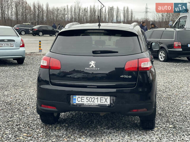 Черный Пежо 4008, объемом двигателя 2 л и пробегом 205 тыс. км за 11950 $, фото 9 на Automoto.ua