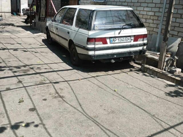 Белый Пежо 405, объемом двигателя 1.6 л и пробегом 400 тыс. км за 400 $, фото 1 на Automoto.ua