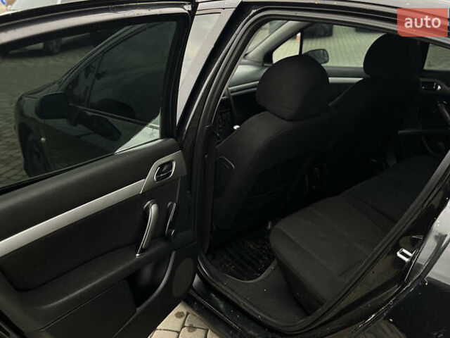 Черный Пежо 407, объемом двигателя 1.75 л и пробегом 238 тыс. км за 3700 $, фото 18 на Automoto.ua